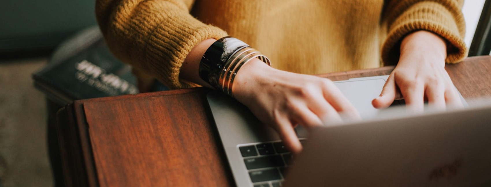 Woman typing on laptop